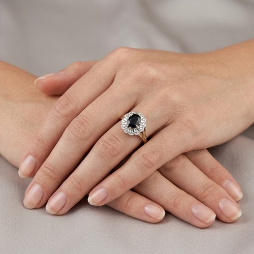 12 - Star Lot: A fabulous large vintage Sapphire and Diamond ring set in nine carat gold. Size - O 1/2, W... 