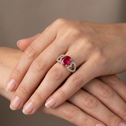 38 - A large vibrant Red Moissanite gemstone ring set with heart set gemstone shoulder. set in Sterling S... 