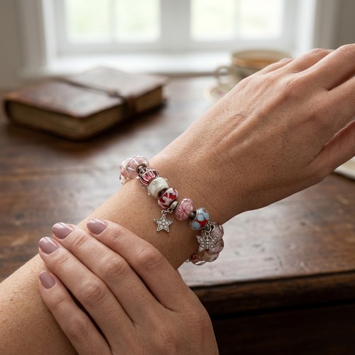 53 - Two Sterling Silver bracelets set with Pandora style charms. Total weight - 80 grams. Please note, t... 