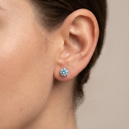 5 - Star Lot : A pretty pair of Blue Topaz gemstone earrings. Mounted in nine carat gold. Weight - 0.54 ... 