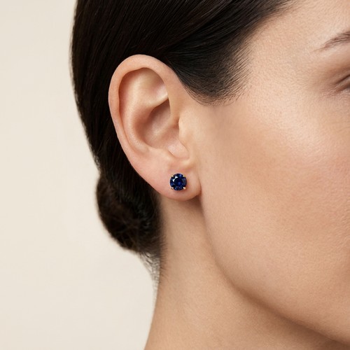 13 - Star Lot: A pretty dainty pair of Sapphire stud earrings set in 14 carat gold. Weight - 0.6 grams. P... 