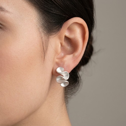 35 - A pair of Sterling Silver leaf designed stud earrings. Weight - 3.5 grams. Please note, the image of... 