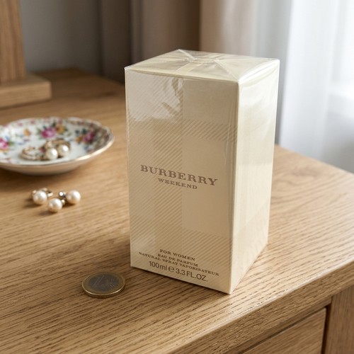 56 - A boxed 100ML bottle of Burberry Weekend for Woman Eau de Parfum. Please note, the image of the mode... 