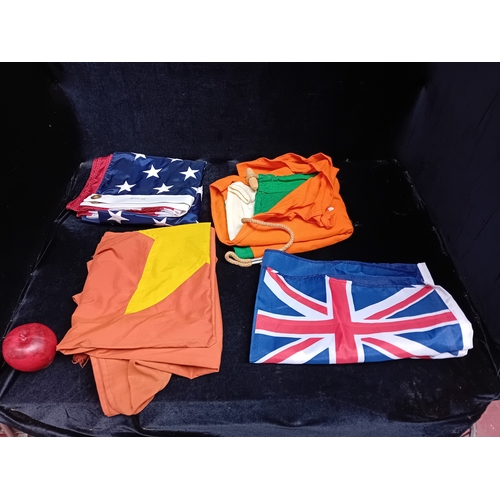 A collection of four flags. Lot includes examples for Ireland, America ...