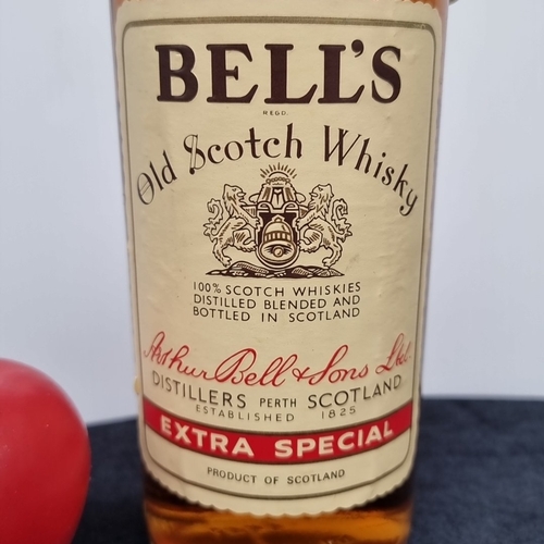 A vintage Bell's Old Scotch Whisky 'Extra Special'—a clear-glass