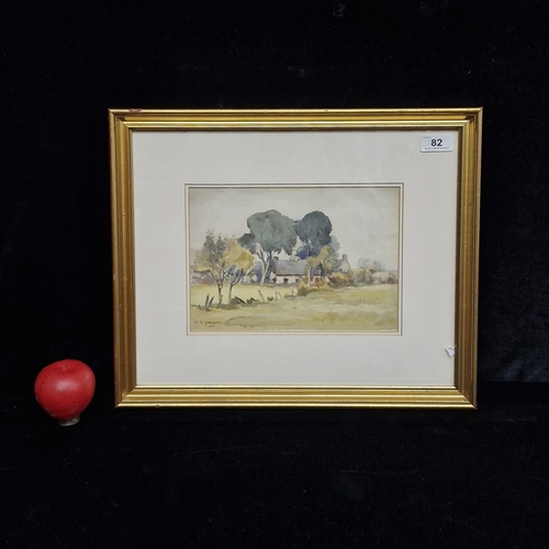 82 - A 'C.R Greaves; watercolour on paper painting. Features a quaint rural landscape with fields and cot... 