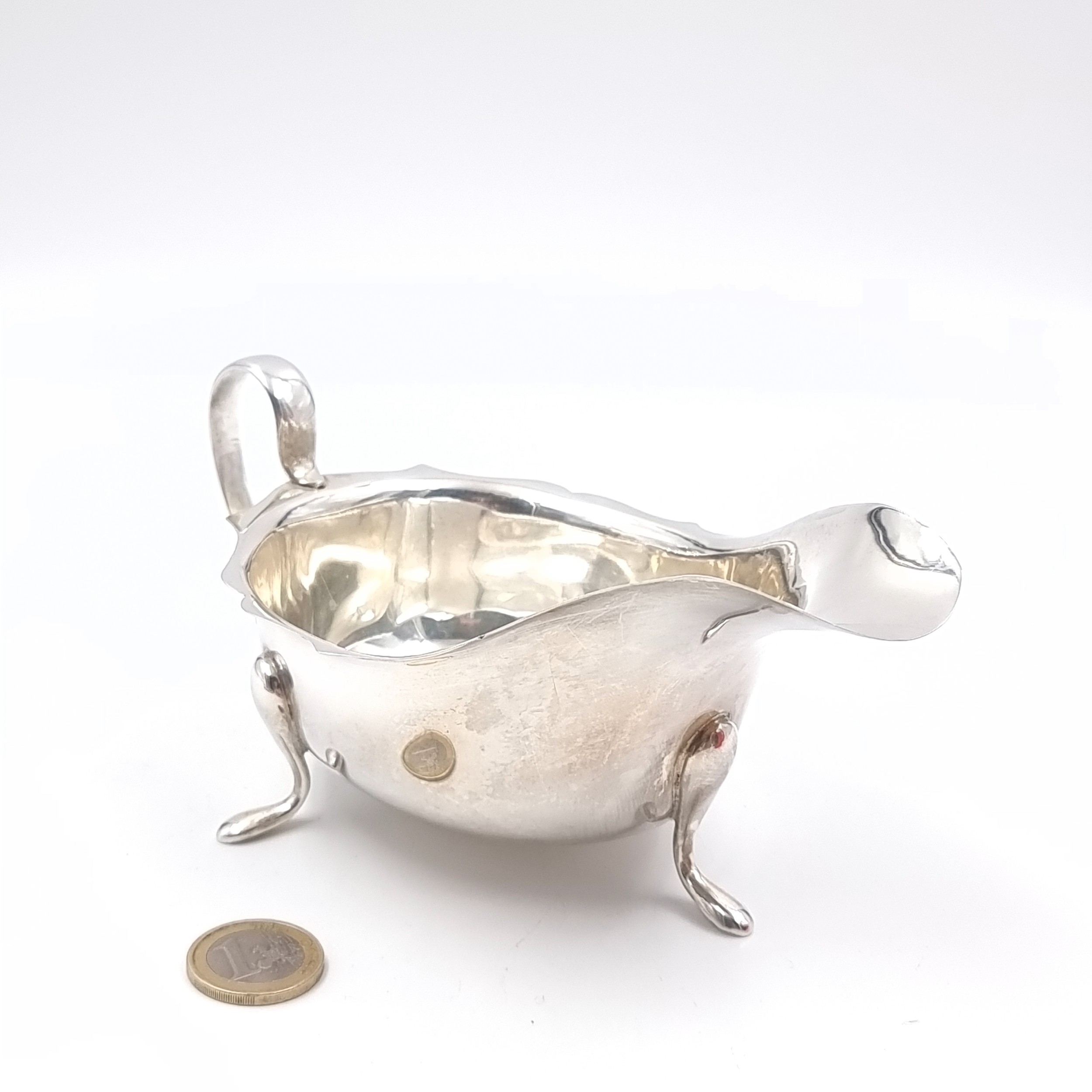 Star Lot: An impressive large sterling silver sauce boat featuring a ...