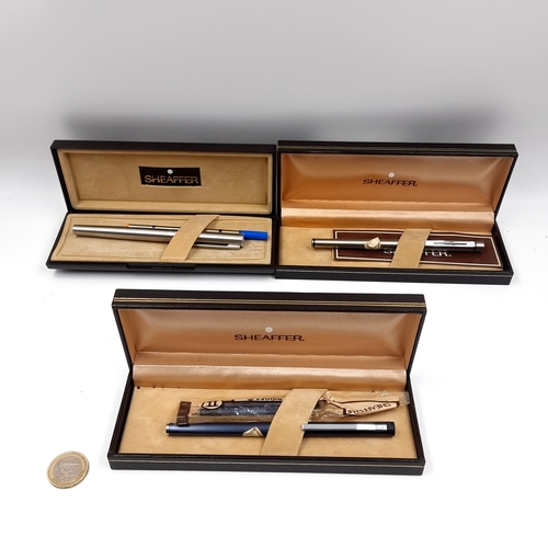 Three vintage Sheaffer fountain pens with cartridges and presented in original boxes.
