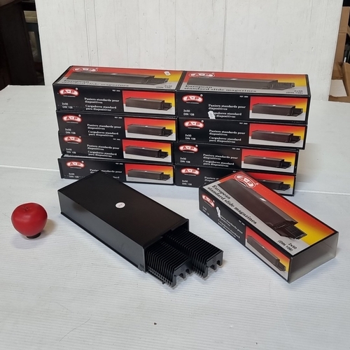 Nine brand new Photo Accessories European standard slide magazines, DIN 108, ref. 2005, in black moulded plastic; each marked 2x50, with ribbed rectangular cases and slotted ends, various boxed.