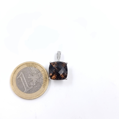 A large smoky quartz pendant. Set in 9ct gold. Weight - 2.46 grams. (pendent only, chain only pictured for effect )