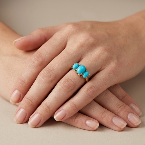 21 - A lovely 3 stone, trinity turquoise ring. Set in sterling silver gilt. Size P. Weight - 3 grams.