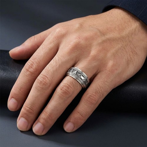 22 - A gents sterling silver articulated, spinning  ring, showing Asian script. Size V. Weight - 9.2 gram... 