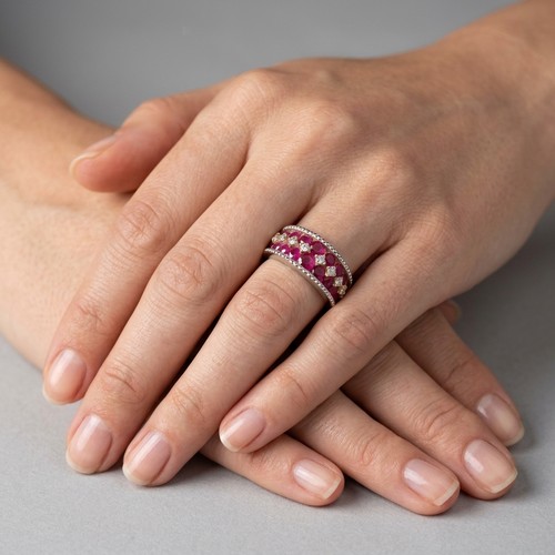 27 - An attractive ruby and topaz gemstone ring. Set in sterling silver. Size N 1/2. Weight - 4.63 grams.