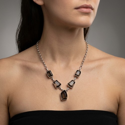 15 - A sterling silver smoky quartz 5 panel necklace. Total weight - 23.35 grams.