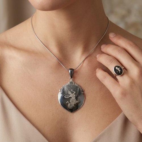 18 - 2 sterling silver Siamese items. A pendant together with a ring. Ring Size M. Weight of ring 2.88 gr... 