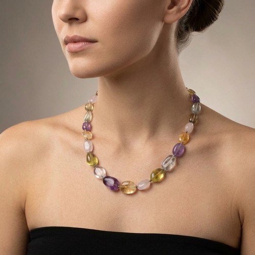 23 - A sterling silver clasp graduated polished stone necklace. Total weight - 76 grams.