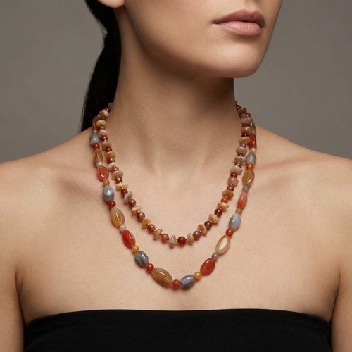 47 - 2 good pairs of polished stone necklaces. Each with twist clasp. Total weight - 130 grams. Stones co... 