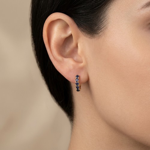 11 - Star Lot : A pair of sapphire stud earrings (1 stone missing). Set in 9ct gold. Weight - 1 gram.