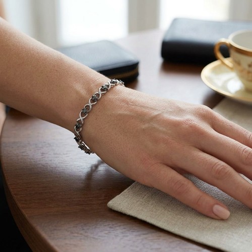 25 - Star Lot : A pretty black diamond line bracelet. Set in sterling silver. Weight - 6.7 grams. With 20... 