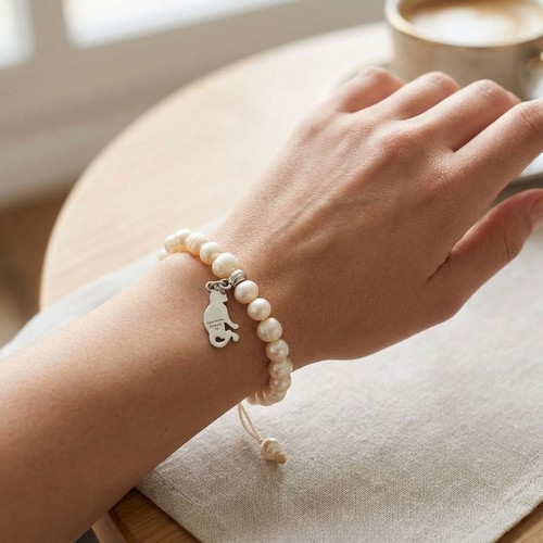 32 - A Thomas Sabo sterling silver pearl set adjustable bracelet. Weight - 21.4 grams.