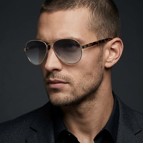 44 - A pair of Guess designer aviators style gold metal frame sunglasses. Lenses in good clean condition.... 