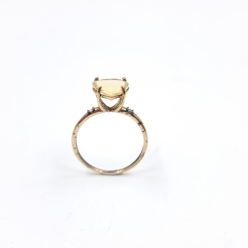 2 - A pretty heart-shaped large citrine gemstone ring. Set in 9ct gold. Size O. Weight - 1.5 grams.
