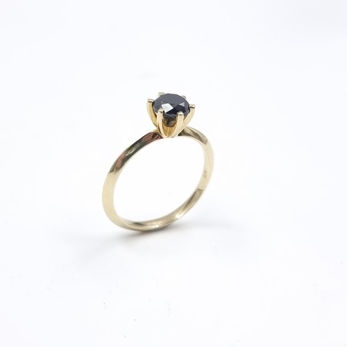 3 - Star Lot : A black diamond crown set ring. Mounted in 9ct gold. Size R 1/2. Weight - 2.45 grams. Est... 