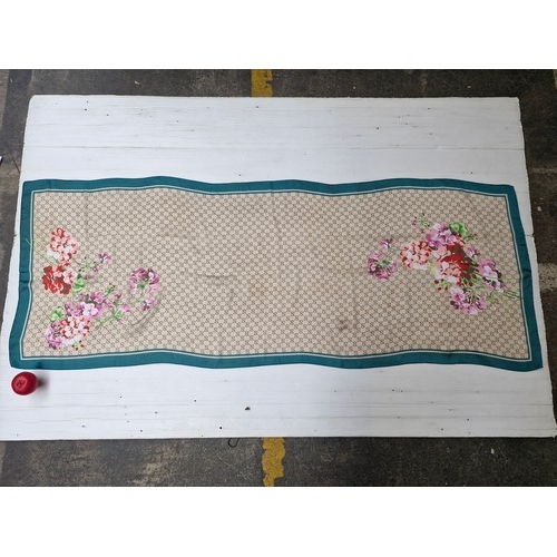 37 - A lovely floral scarf label marked 100% silk.
