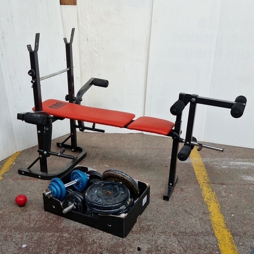 Pro Power weight bench with red padded backrest and seat, barbell ...