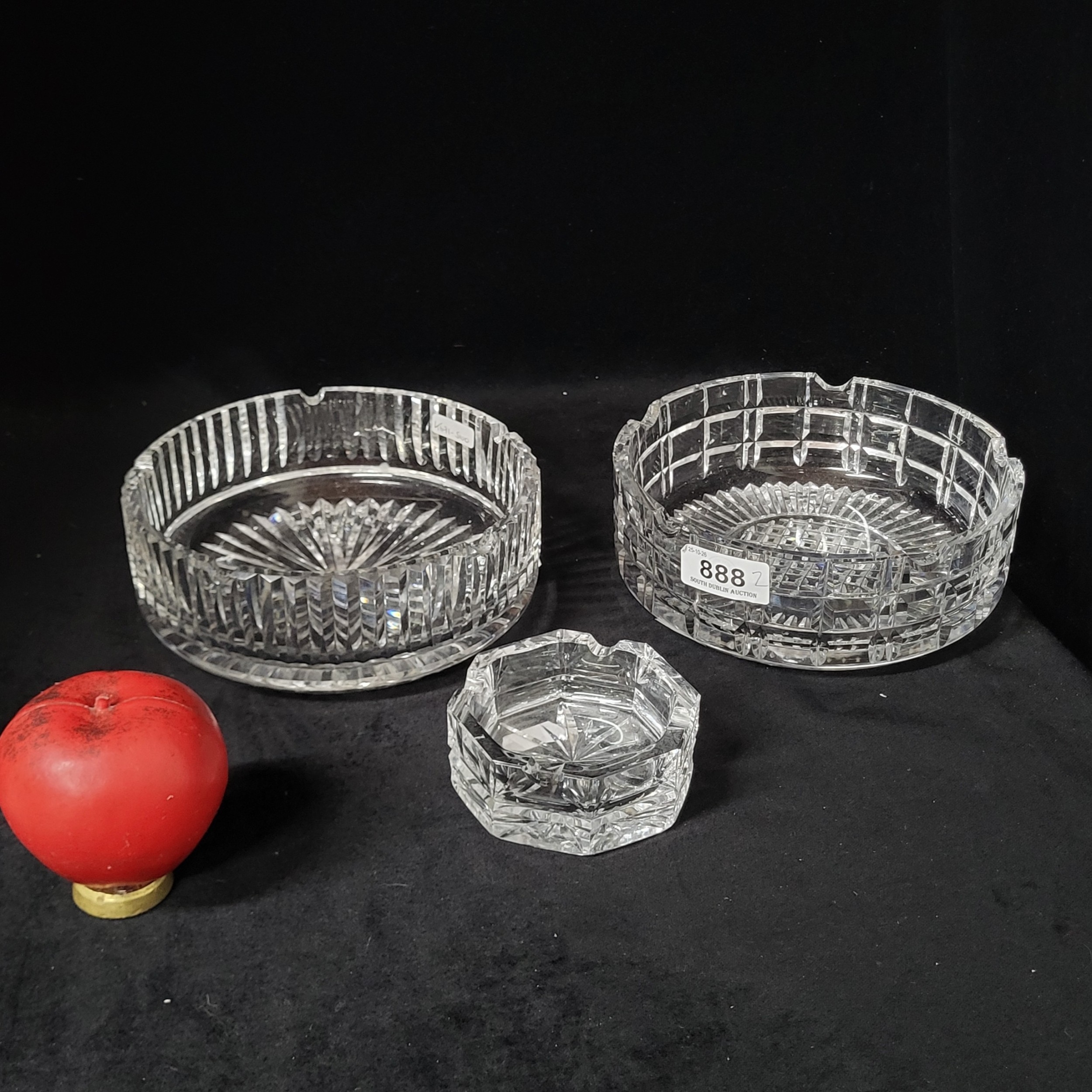A trio of vintage Waterford Crystal ashtrays. Two larger examples of ...