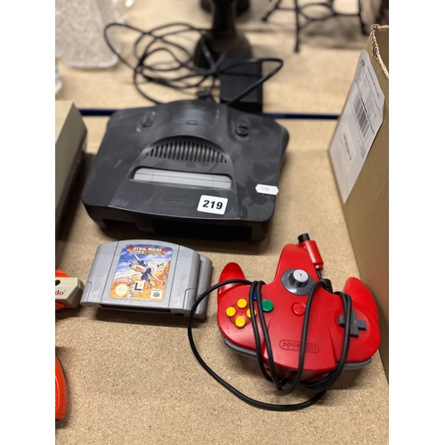 219 - Nintendo 64 console with two games and a controller and 2 games