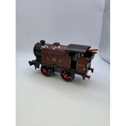 29 - Wicker hamper containing a collection of antique model railway track, engines, rolling stock etc