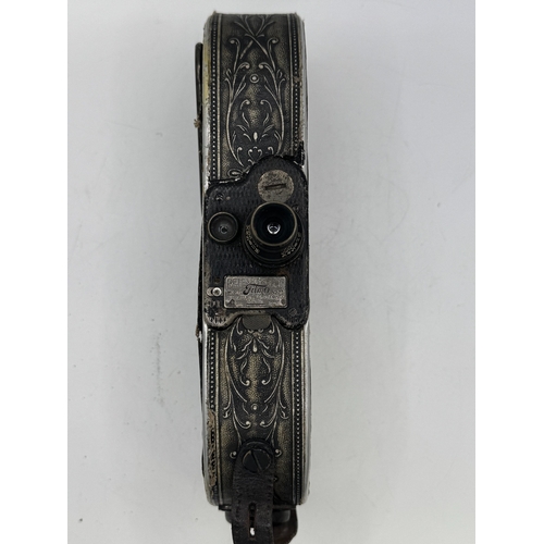 48 - Unusual Bell and Howell Filmo Model no. 75 model automatic cine-camera, associated leather case