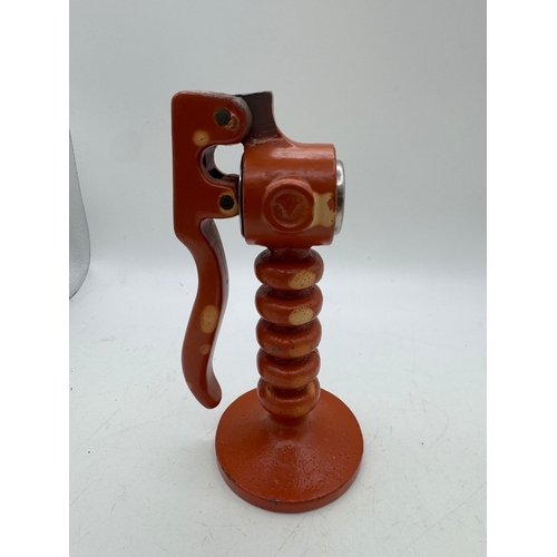 12 - Unusual heavy painted lathe-worked metalwork garlic crusher, 16cm high