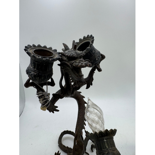 13 - Pair of antique Japanese cast metal twin-light candlesticks in the form of dragons, 11cm high (one A... 