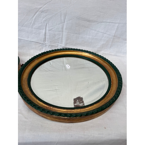 47 - Pair of Regency style circular wall mirrors with painted and gilt framed borders and bevelled plates... 