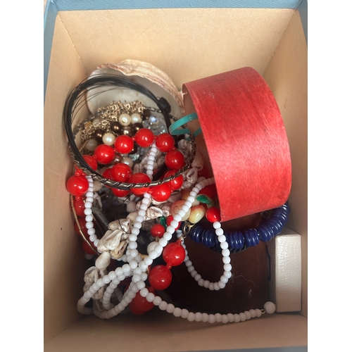 19 - Mixed lot of costume jewellery to include beads, necklaces, a Disney belt buckle, etc