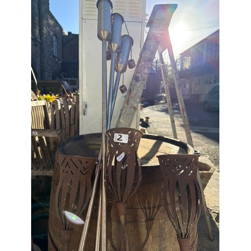 2 - Mixed lot of decorative garden items to include vintage water pump, garden torch’s, etc.