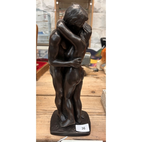 36 - Bronzed resin sculpture depicting a kissing Adam & Eve by Roland Chadwick, signed to base