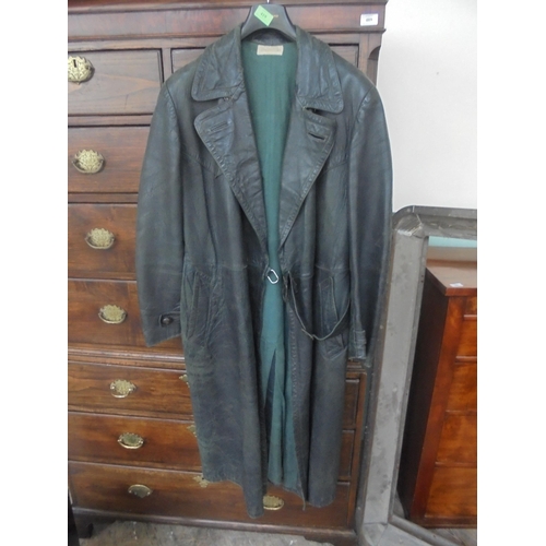 419 - A superb item being a German/Austrian full length leather trench coat in dark green in generally v.g... 