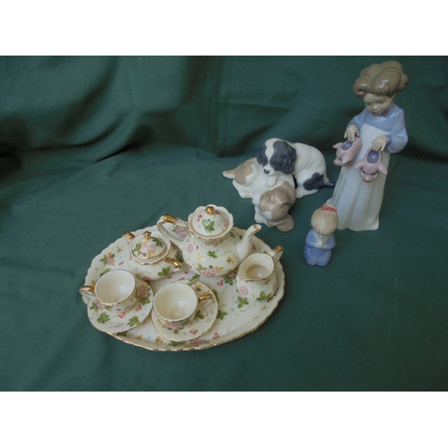 133 - Delightful small ceramic child's tea set to include tray, 2 cups and saucers, sugar, milk and teapot... 