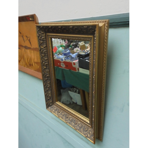 273 - Mirror in heavy gold frame