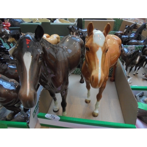 319 - Pair of large Beswick horses, one damaged to ear.