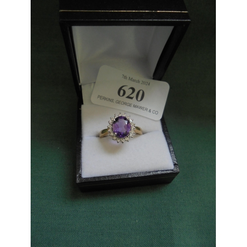 620 - 18 carat amethyst and diamond cluster ring.