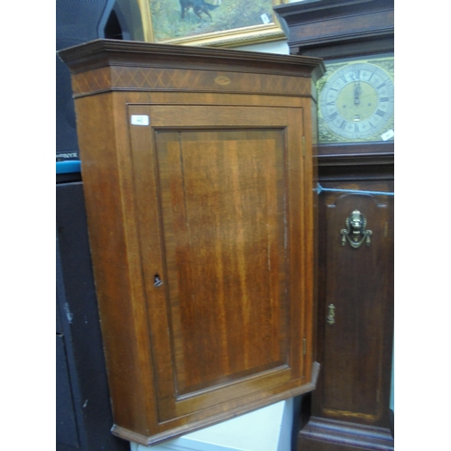 662 - Light oak wall mounted corner cabinet with 3 internal shelves and lock and key