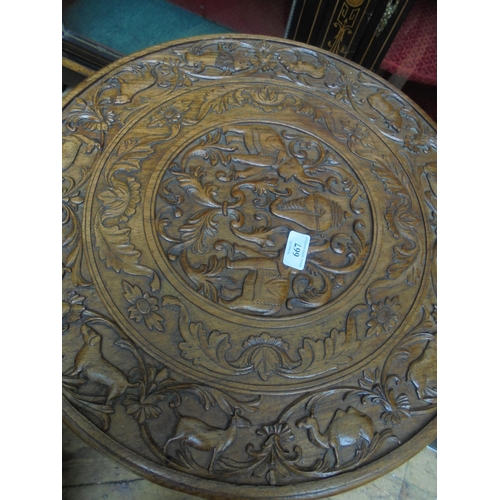 667 - Unusual Indian styled heavily carved side table on 3 legs being ornamental birds