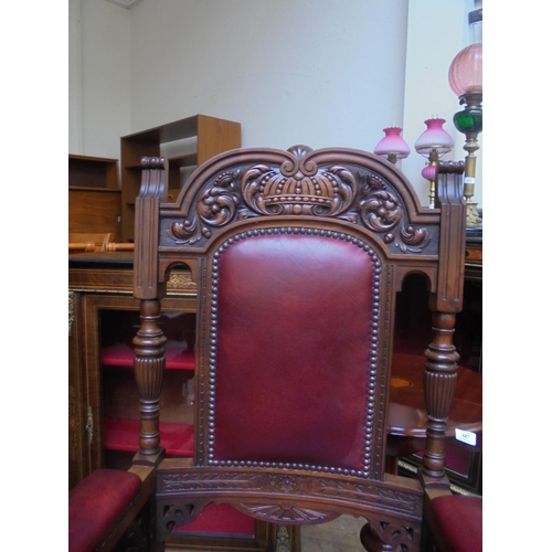 673 - Fine pair of gentleman's armchairs in polished oak on original castors with red leather seating and ... 