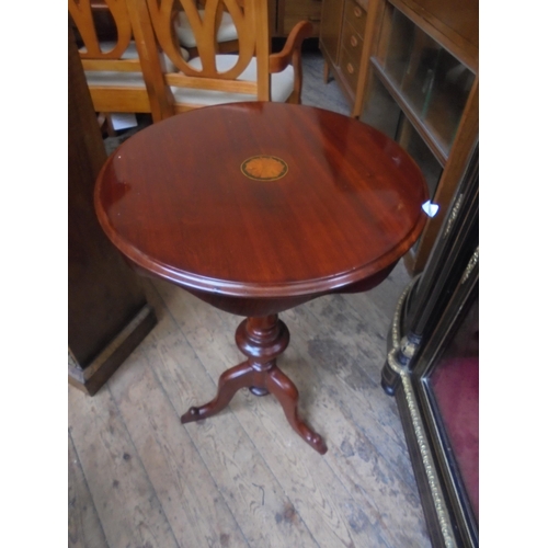 687 - Highly polished tripod based side table with inlaid top.