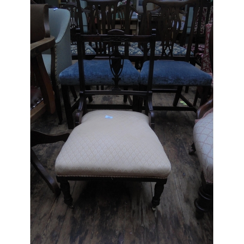 691 - Attractive re-upholstered shield back chair of small proportion with re-upholstered fabric seat.