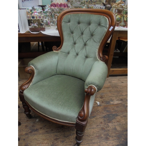 693 - Victorian gentleman's chair in green velour on casters.